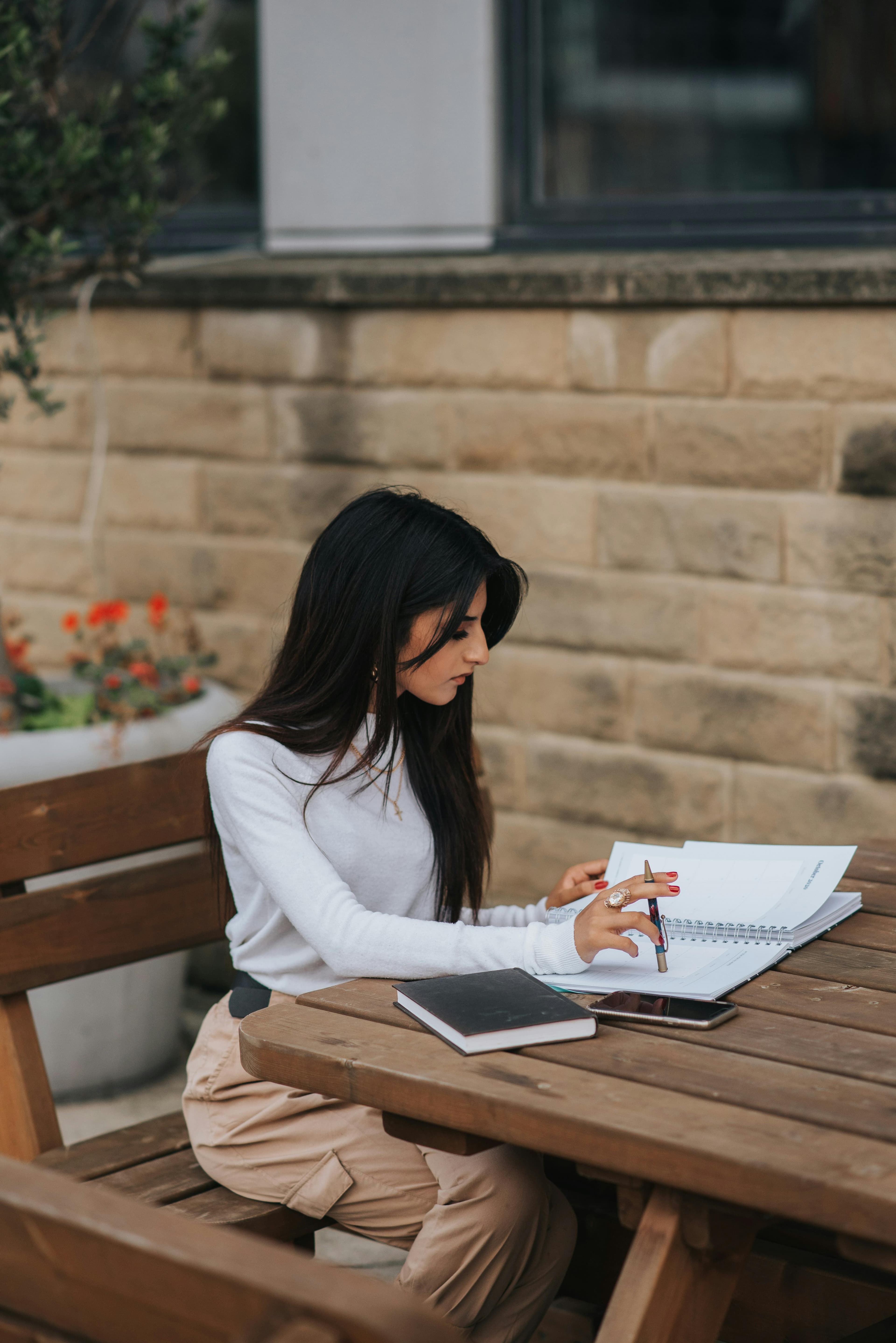 A person calmly reviews notes, evidence, or results.