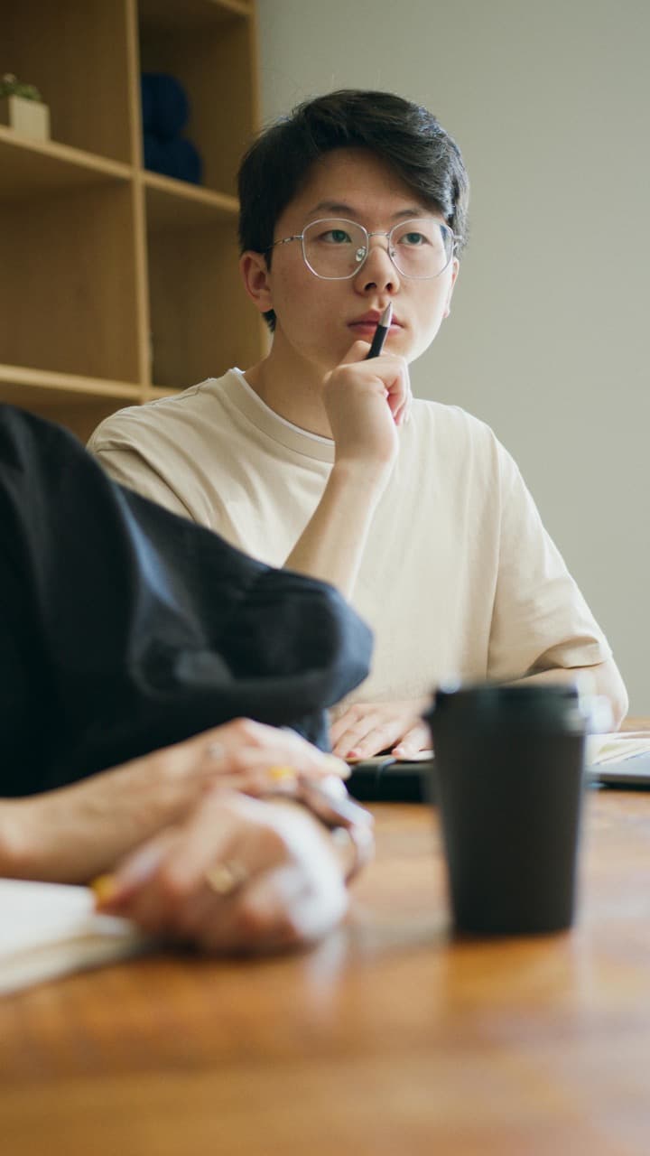 A person calmly reviews notes, evidence, or results.